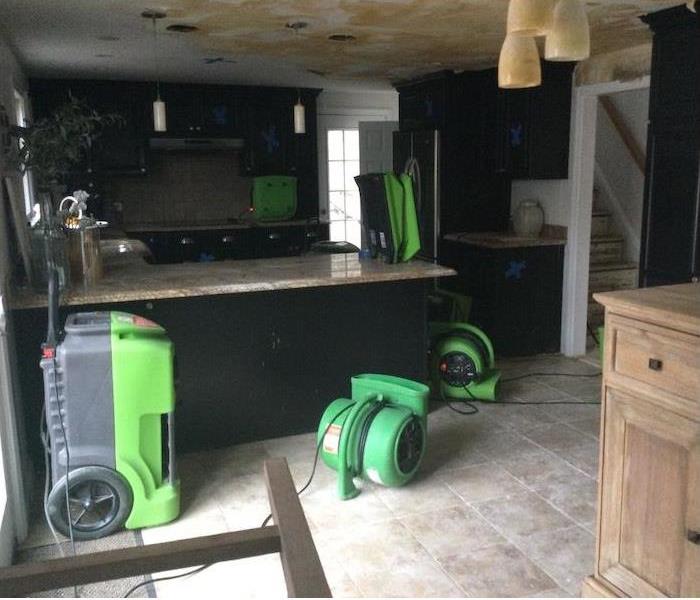 water stained kitchen ceiling with assemblies