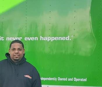 Edwin Carrasquillo near a SERVPRO truck