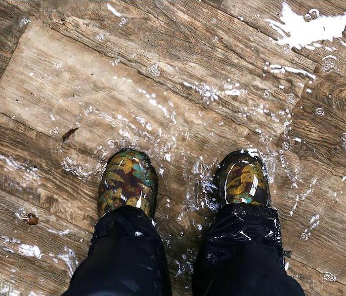 standing in a pool of storm water in home