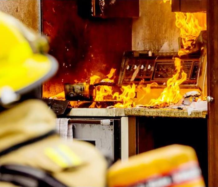 fire in the kitchen with a fireman.