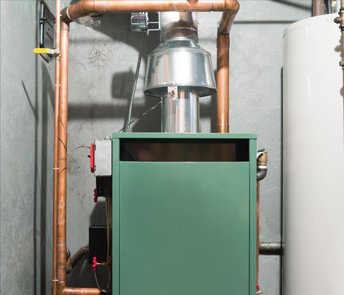 green furnace in basement