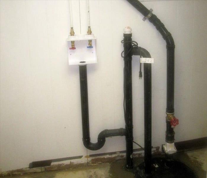 A sump pump installed in a basement