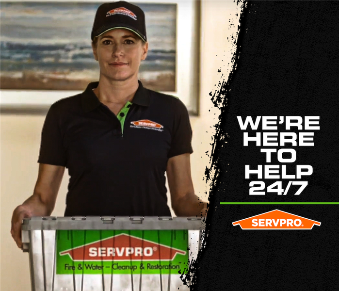 SERVPRO fire damage here to help sign